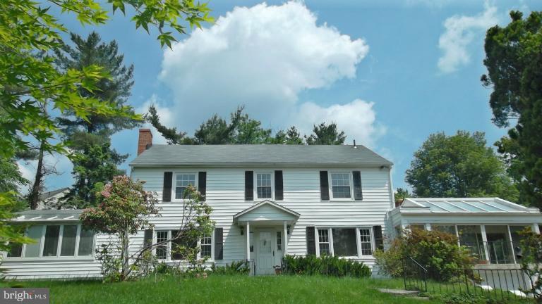 6301 Rt 32 Es Guilford Road Clarksville, MD 21029 - Photo 2 of 28 a front view of a house with a garden