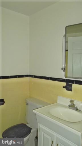 6301 Rt 32 Es Guilford Road Clarksville, MD 21029 - Photo 15 of 28 a bathroom with a sink and a mirror