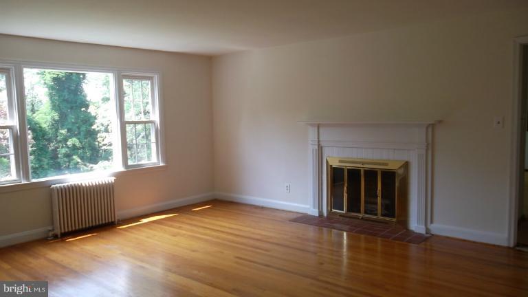 6301 Rt 32 Es Guilford Road Clarksville, MD 21029 - Photo 17 of 28 an empty room with wooden floor and windows