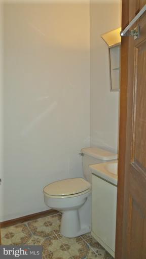 6301 Rt 32 Es Guilford Road Clarksville, MD 21029 - Photo 19 of 28 a bathroom with a toilet and a shower