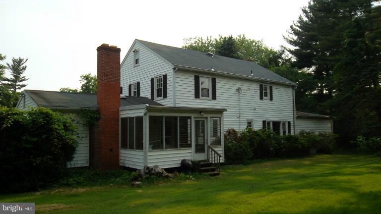 6301 Rt 32 Es Guilford Road Clarksville, MD 21029 - Photo 23 of 28 a view of house with a yard