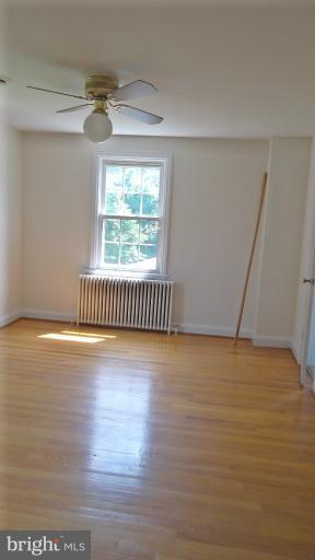 6301 Rt 32 Es Guilford Road Clarksville, MD 21029 - Photo 24 of 28 a view of an empty room with wooden floor and a window