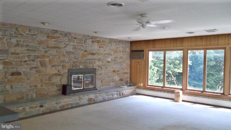 6301 Rt 32 Es Guilford Road Clarksville, MD 21029 - Photo 25 of 28 a view of an empty room with a fireplace