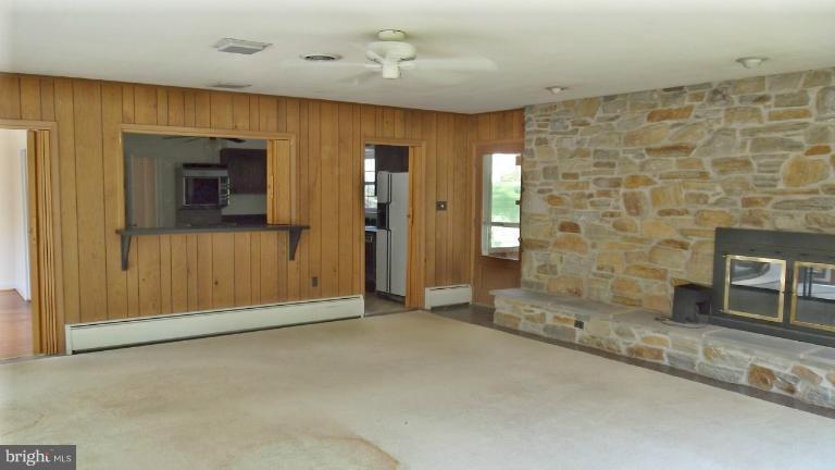 6301 Rt 32 Es Guilford Road Clarksville, MD 21029 - Photo 26 of 28 a view of an empty room with a fireplace