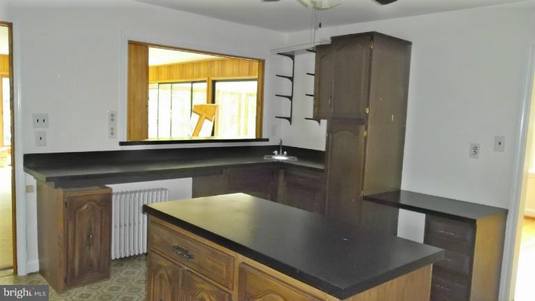 6301 Rt 32 Es Guilford Road Clarksville, MD 21029 - Photo 6 of 28 a kitchen with a window sink and cabinets