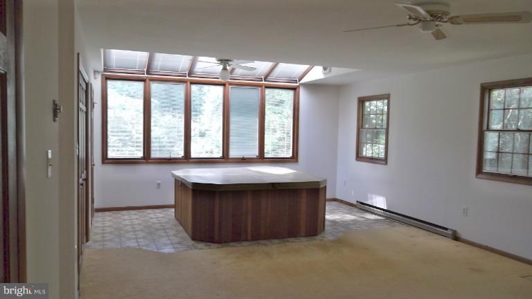 6301 Rt 32 Es Guilford Road Clarksville, MD 21029 - Photo 9 of 28 an empty room with windows