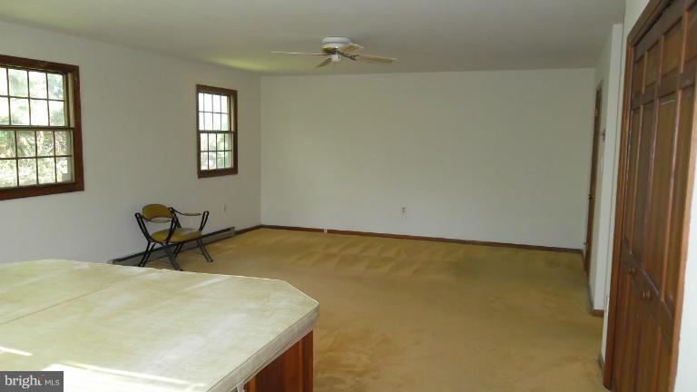 6301 Rt 32 Es Guilford Road Clarksville, MD 21029 - Photo 10 of 28 a room with a table and chair
