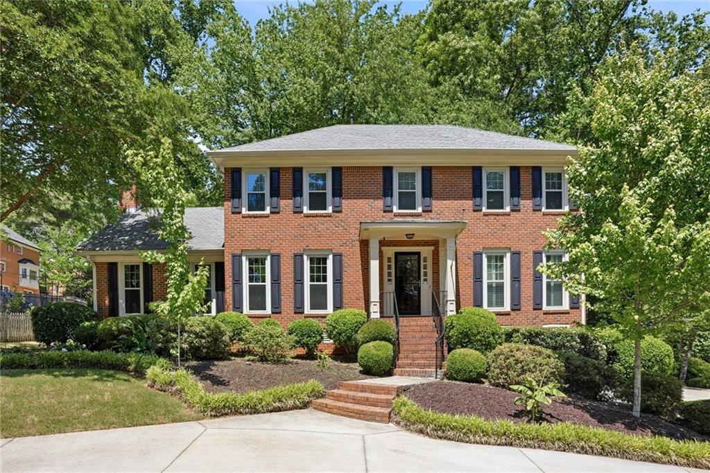 210 Woodrill Way Atlanta, GA 30350 - Photo 1 of 34 a front view of a house with a yard