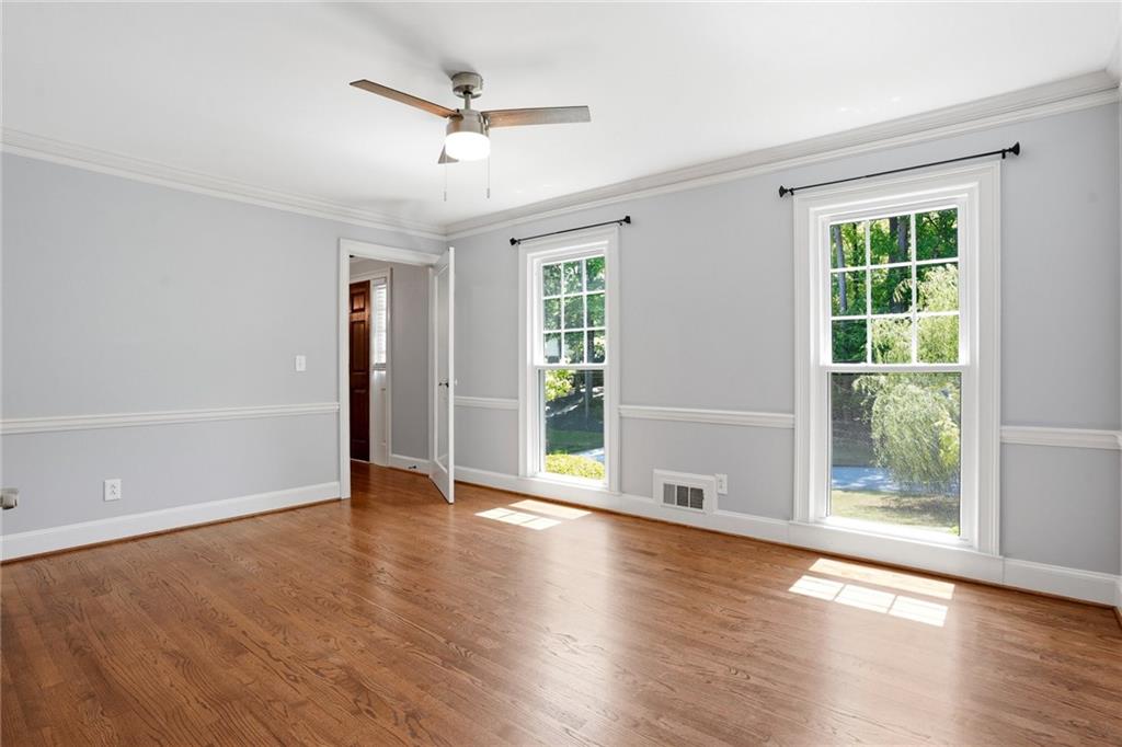 210 Woodrill Way Atlanta, GA 30350 - Photo 17 of 34 a view of an empty room with wooden floor and a window