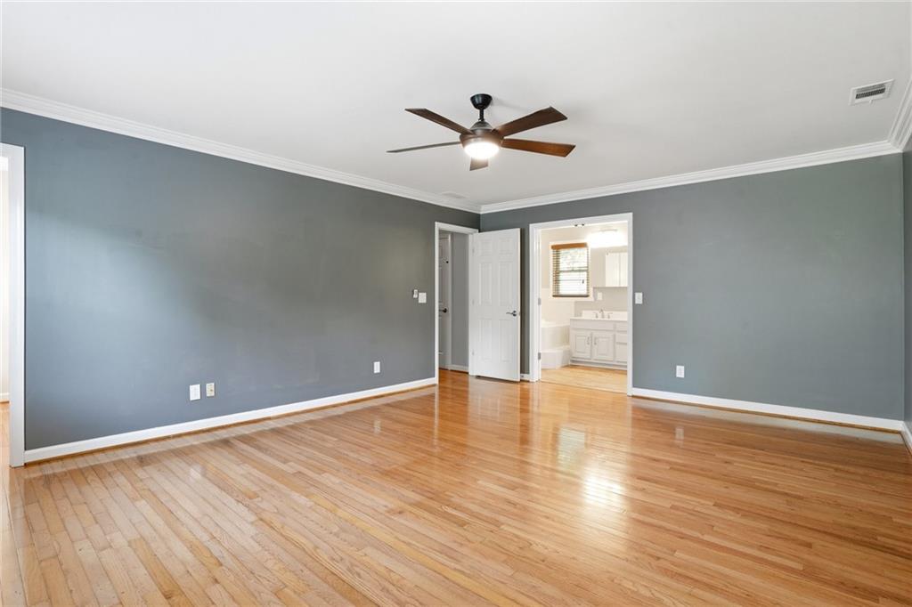 210 Woodrill Way Atlanta, GA 30350 - Photo 18 of 34 a view of an empty room with window and wooden floor