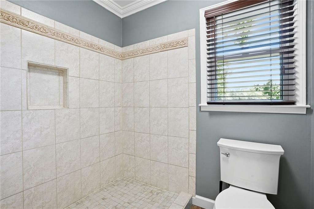 210 Woodrill Way Atlanta, GA 30350 - Photo 20 of 34 a white toilet sitting next to a bathroom sink