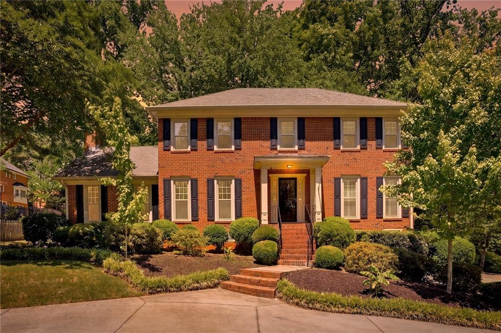 210 Woodrill Way Atlanta, GA 30350 - Photo 2 of 34 a front view of a house with a yard