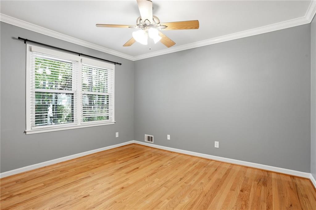 210 Woodrill Way Atlanta, GA 30350 - Photo 21 of 34 wooden floor in an empty room with a window