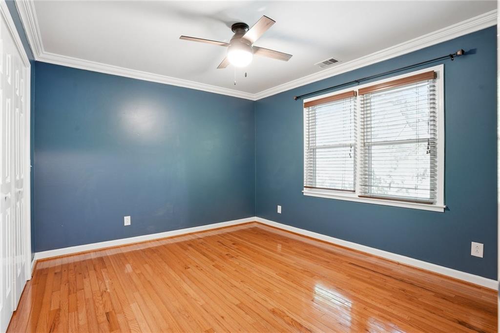 210 Woodrill Way Atlanta, GA 30350 - Photo 23 of 34 a view of empty room with wooden floor and fan