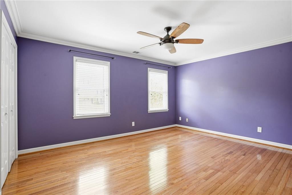 210 Woodrill Way Atlanta, GA 30350 - Photo 24 of 34 a view of empty room with wooden floor and fan