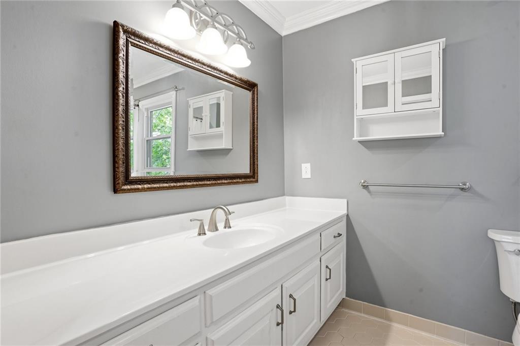 210 Woodrill Way Atlanta, GA 30350 - Photo 26 of 34 a bathroom with a sink and a mirror