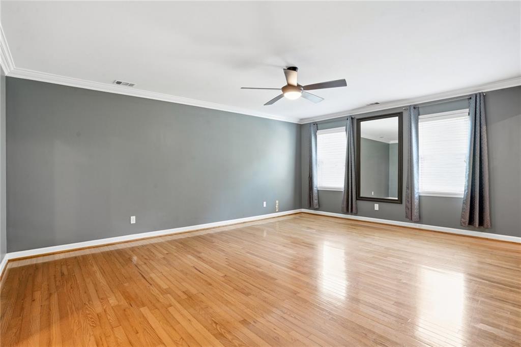 210 Woodrill Way Atlanta, GA 30350 - Photo 27 of 34 a view of an empty room with window and wooden floor