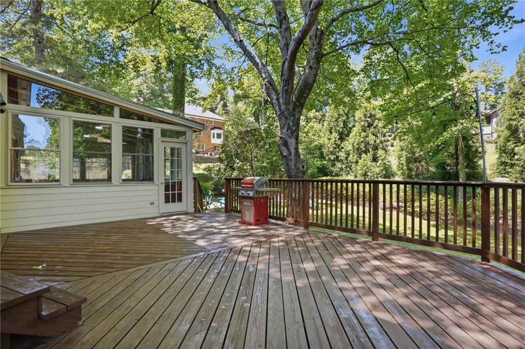 210 Woodrill Way Atlanta, GA 30350 - Photo 6 of 34 a view of a house with wooden deck and floor to ceiling windows