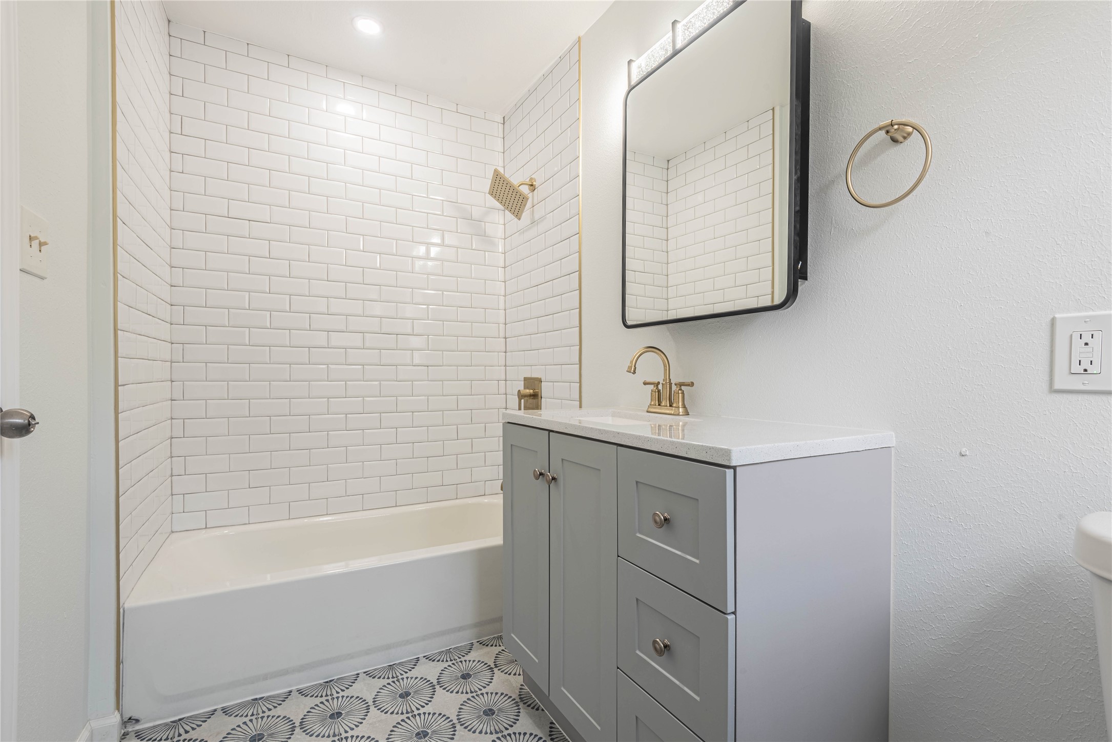 2303 Rosewood Street, Unit 6 Houston, TX 77004 - Photo 13 of 15 a bathroom with a double vanity sink mirror and bathtub