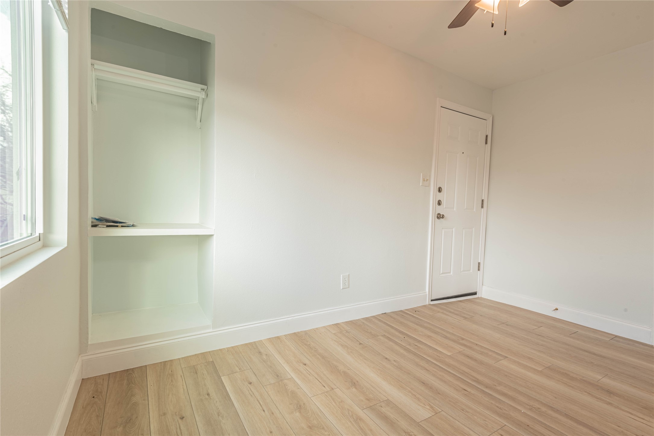 2303 Rosewood Street, Unit 6 Houston, TX 77004 - Photo 4 of 15 a view of empty room with wooden floor