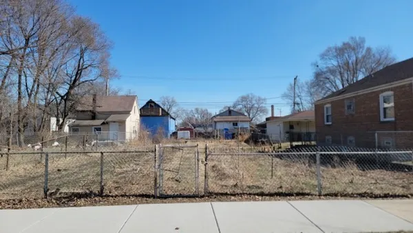 a view of a large house with a yard