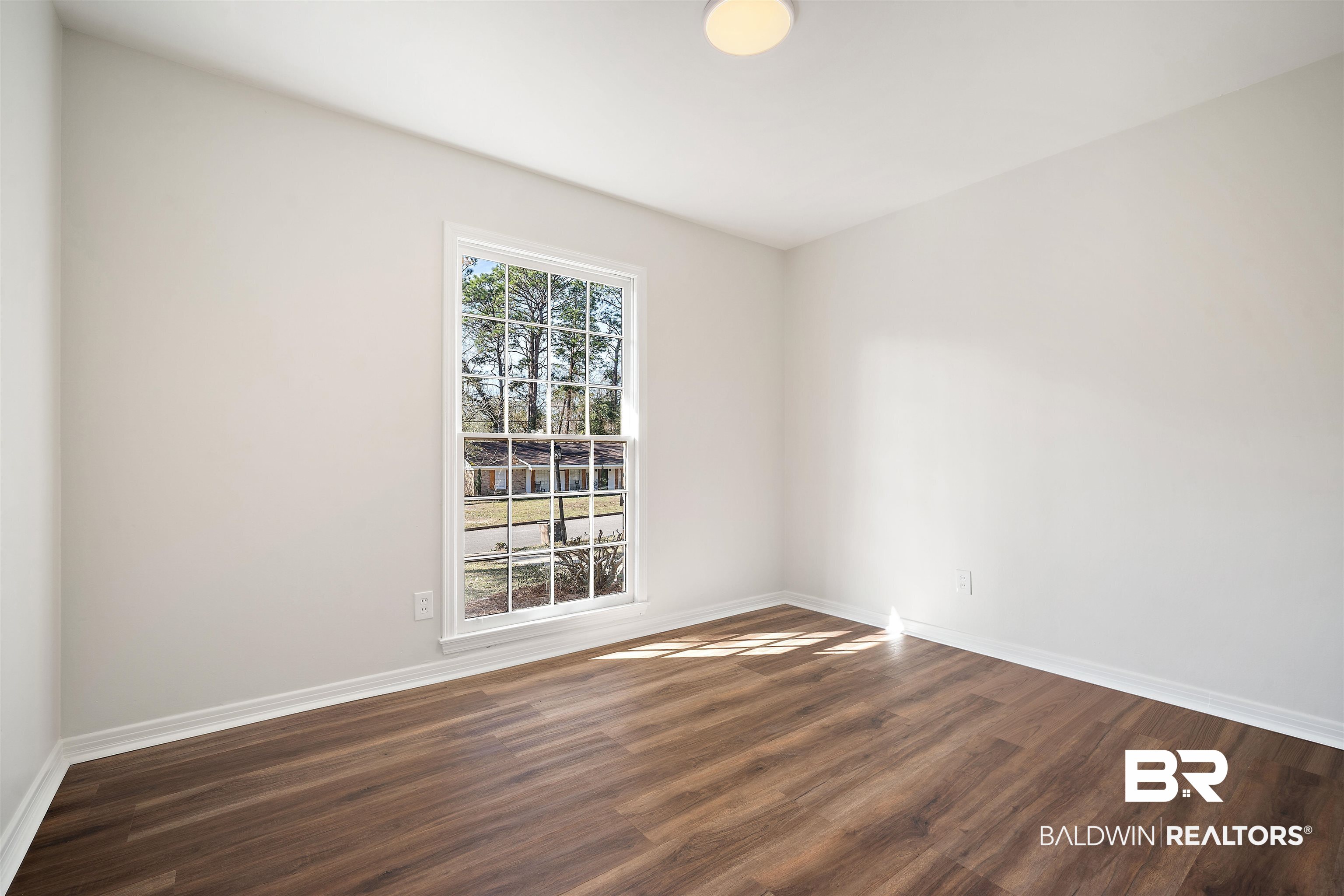 860 Montfort Road South Mobile, AL 36608 - Photo 21 of 27 Unfurnished room with dark wood finished floors and baseboards