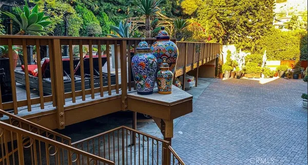a view of outdoor space with wooden floor and stairs