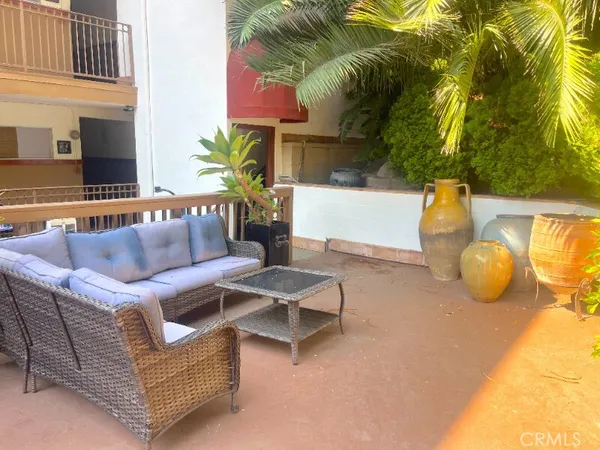 a outdoor living space with furniture and a potted plant