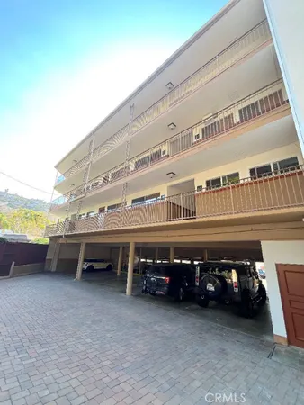 a view of a swimming pool with furniture