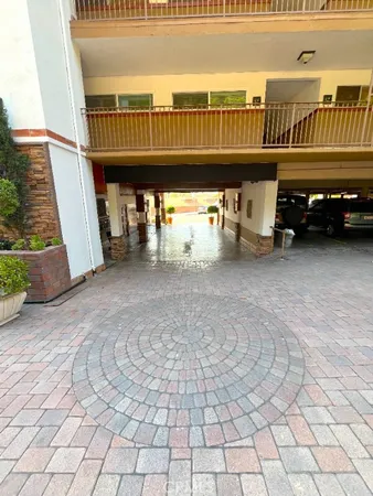 a view of a balcony with car parked