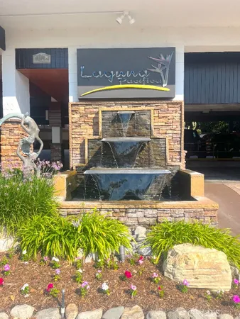 a view of swimming pool with a yard