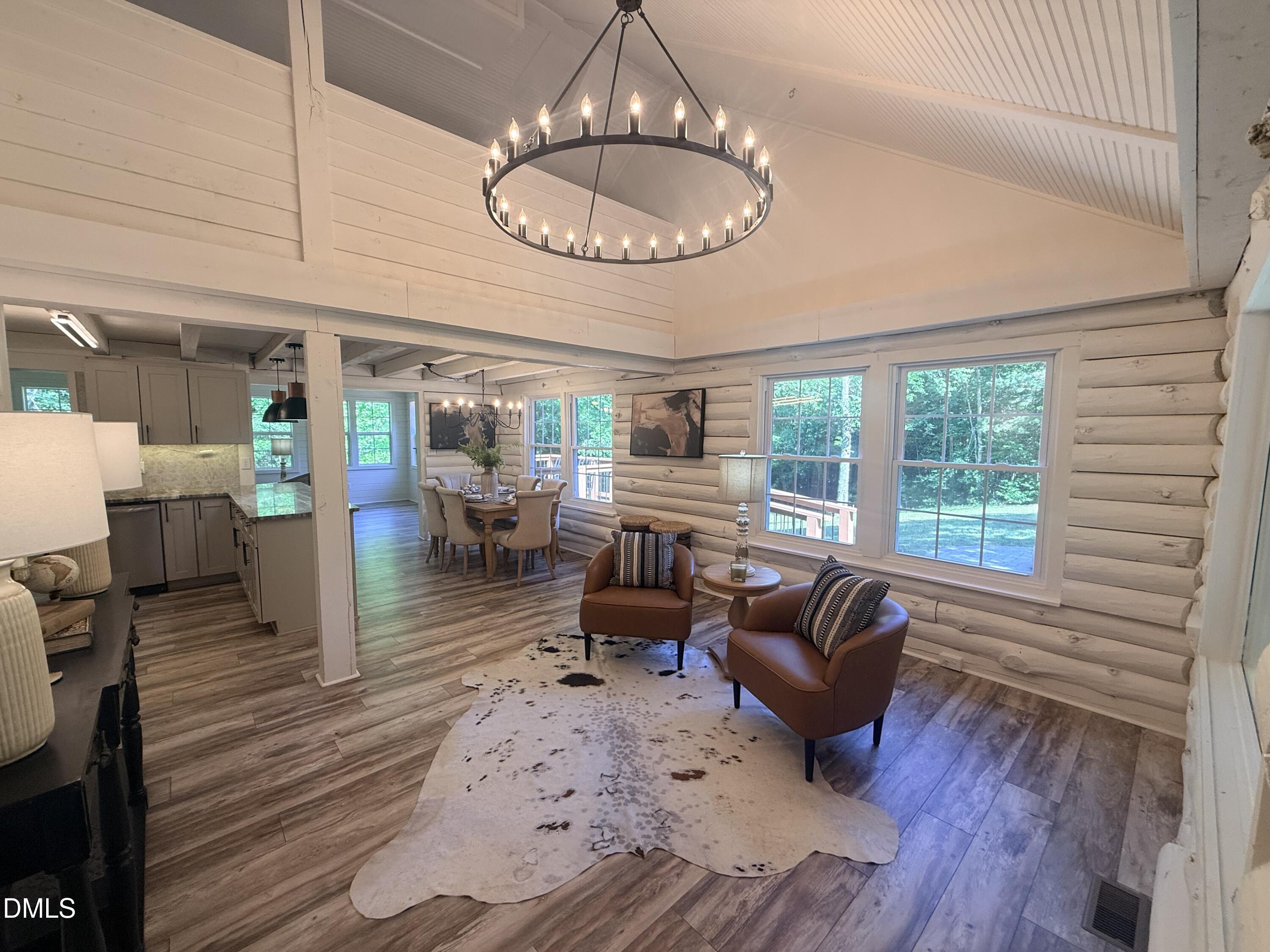 327 Shady Oak Road Roxboro, NC 27574 - Photo 7 of 62 a living room with furniture chandelier and a large window