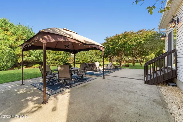 a view of a chairs and table in the patio