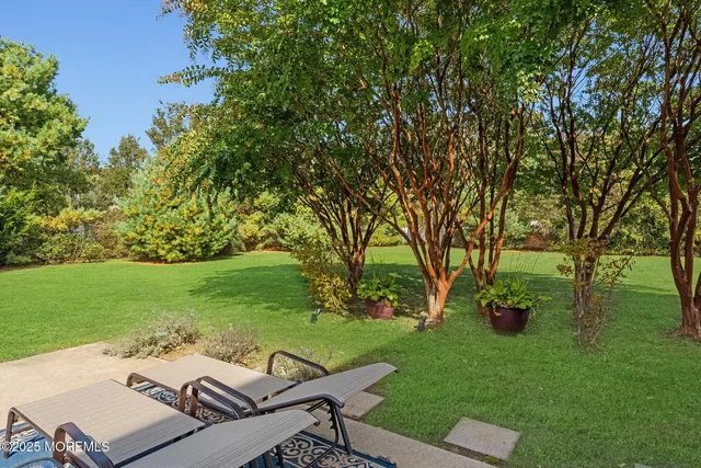 a view of a backyard with sitting area