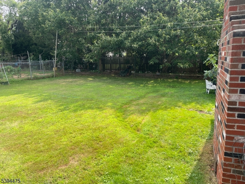 192 West Mt Pleasant Avenue, Unit 1 Livingston, NJ 07039 - Photo 9 of 10 a backyard of a house with swimming pool and green space