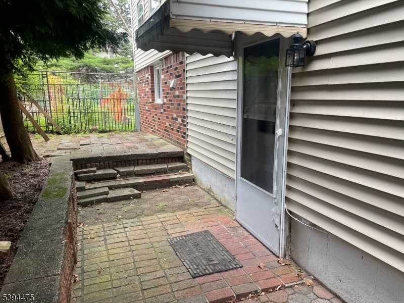 192 West Mt Pleasant Avenue, Unit 1 Livingston, NJ 07039 - Photo 10 of 10 a view of backyard with wooden floor and a large window