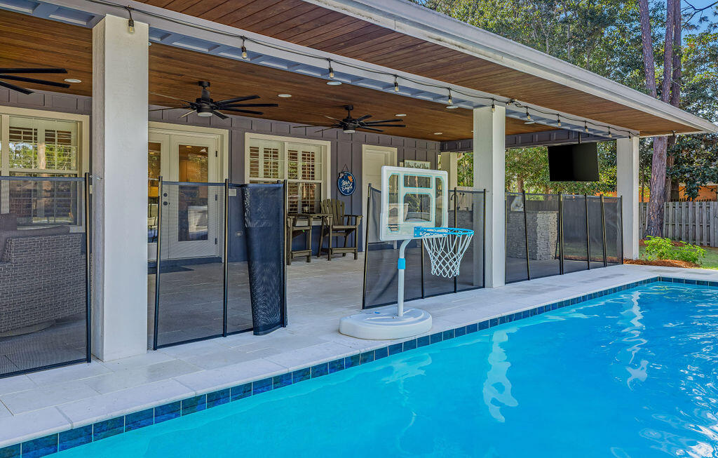 442 Shipwreck Road Santa Rosa Beach, FL 32459 - Photo 12 of 103 a view of a patio with a table and chairs