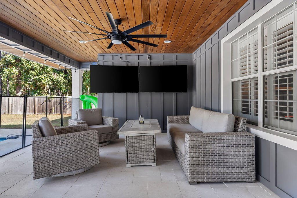 442 Shipwreck Road Santa Rosa Beach, FL 32459 - Photo 19 of 103 a outdoor living space with patio furniture and a fireplace
