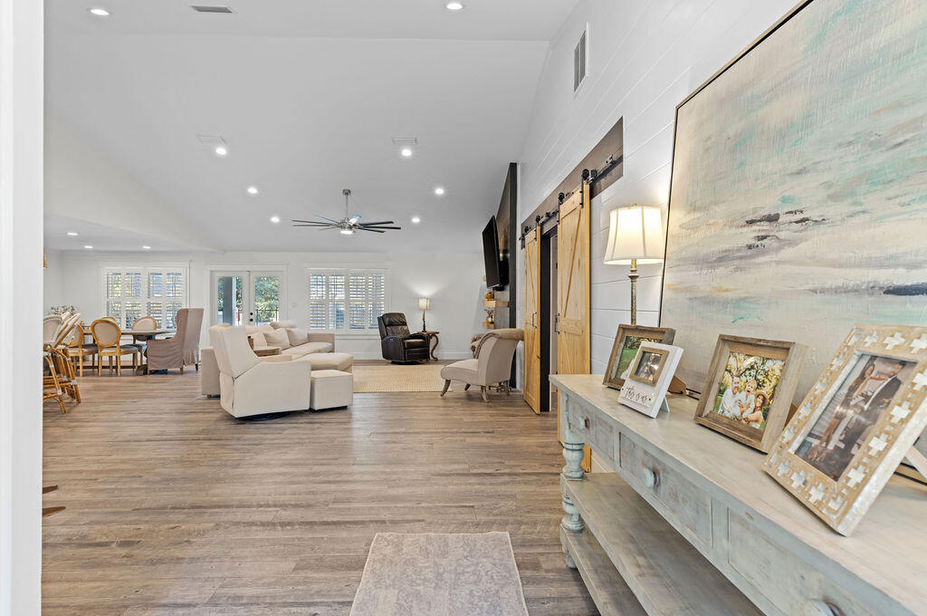 442 Shipwreck Road Santa Rosa Beach, FL 32459 - Photo 23 of 103 a living room with furniture and a flat screen tv