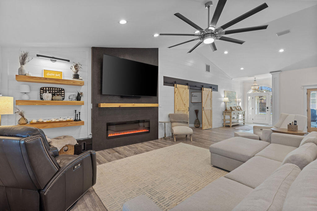442 Shipwreck Road Santa Rosa Beach, FL 32459 - Photo 33 of 103 a living room with furniture and a flat screen tv