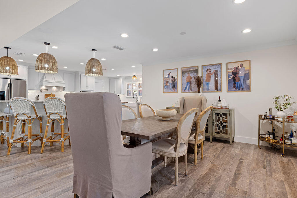 442 Shipwreck Road Santa Rosa Beach, FL 32459 - Photo 40 of 103 a view of a dining room with furniture and wooden floor