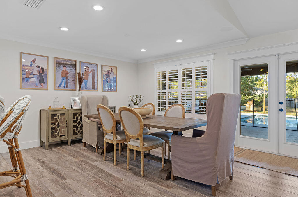 442 Shipwreck Road Santa Rosa Beach, FL 32459 - Photo 41 of 103 a view of a dining room with furniture window and wooden floor