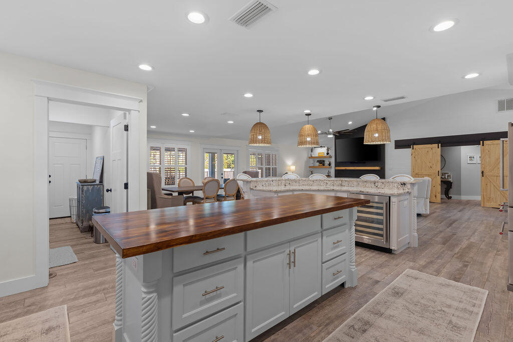 442 Shipwreck Road Santa Rosa Beach, FL 32459 - Photo 43 of 103 a kitchen with kitchen island granite countertop a sink a counter top space stainless steel appliances and cabinets