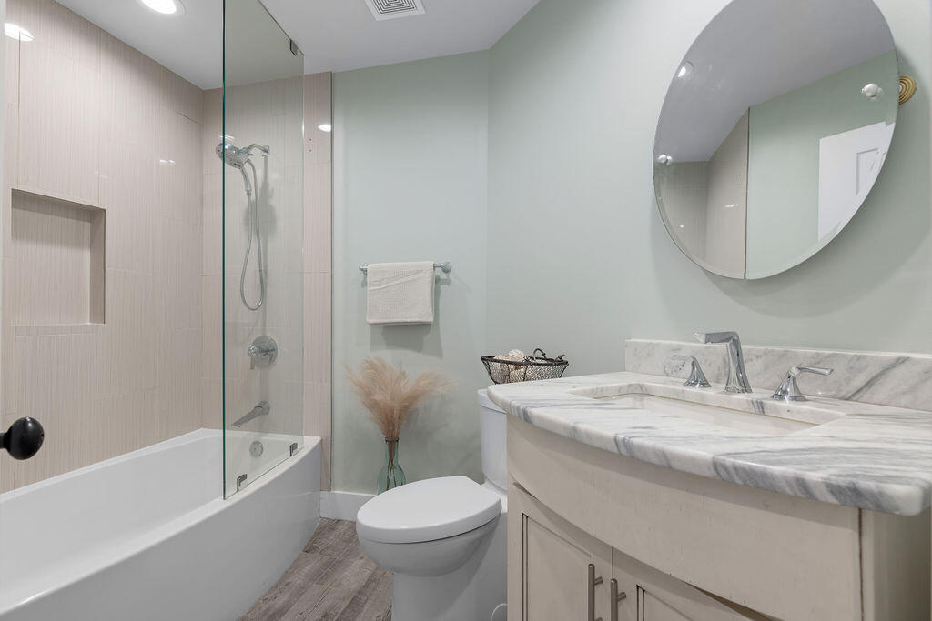 442 Shipwreck Road Santa Rosa Beach, FL 32459 - Photo 52 of 103 a bathroom with a granite countertop sink toilet and shower