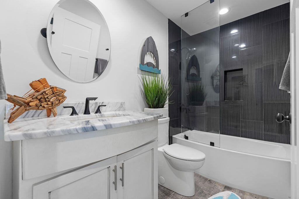 442 Shipwreck Road Santa Rosa Beach, FL 32459 - Photo 57 of 103 a bathroom with a toilet sink and mirror