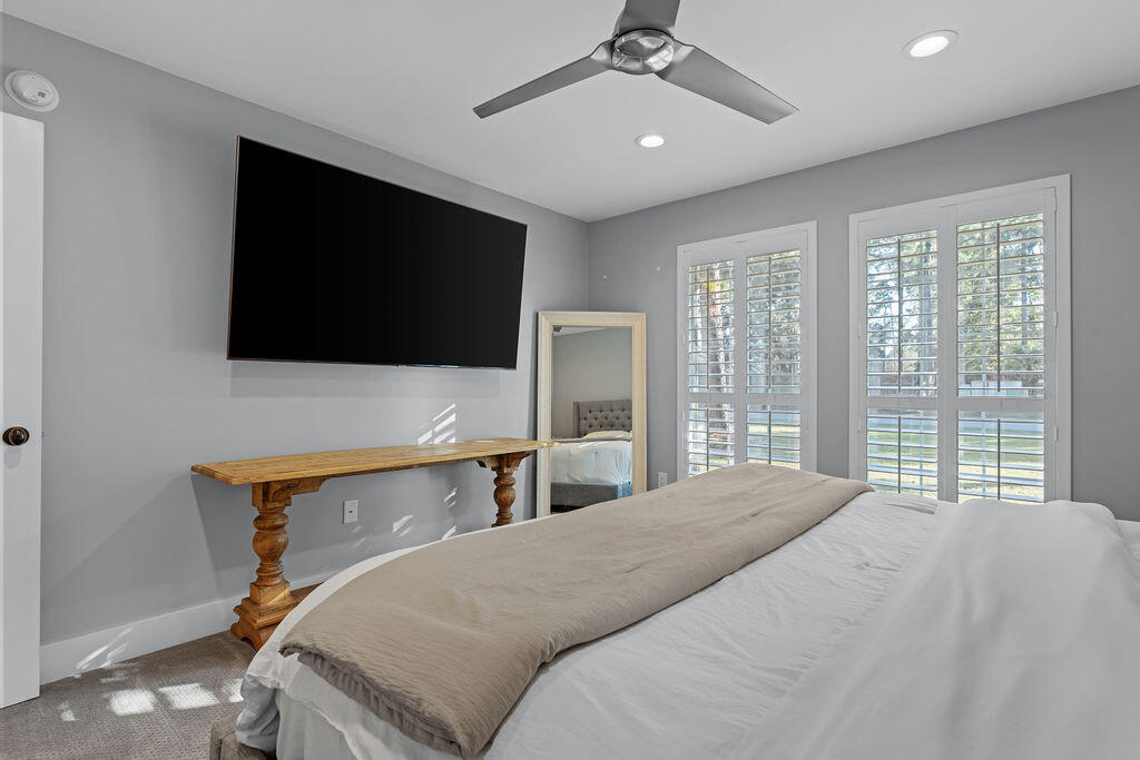 442 Shipwreck Road Santa Rosa Beach, FL 32459 - Photo 61 of 103 a bedroom with a bed and a flat screen tv