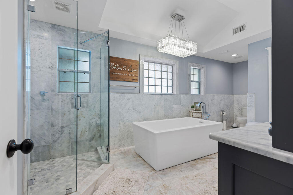 442 Shipwreck Road Santa Rosa Beach, FL 32459 - Photo 68 of 103 a spacious bathroom with a sink a shower and a mirror