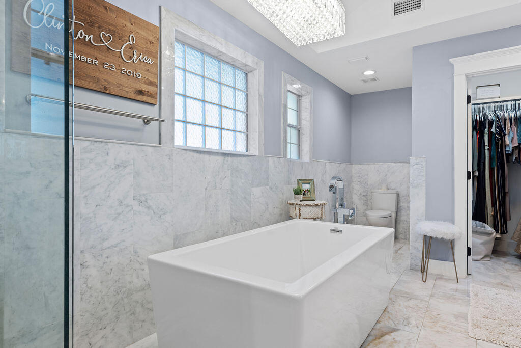 442 Shipwreck Road Santa Rosa Beach, FL 32459 - Photo 69 of 103 a white bath tub sitting next to a bathroom sink