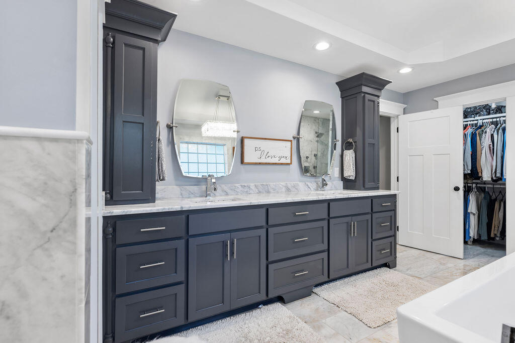442 Shipwreck Road Santa Rosa Beach, FL 32459 - Photo 72 of 103 a spacious bathroom with a granite countertop sink and a mirror