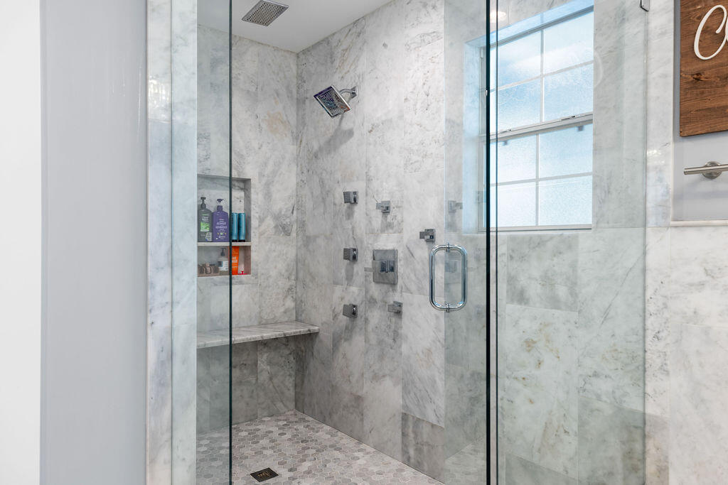 442 Shipwreck Road Santa Rosa Beach, FL 32459 - Photo 73 of 103 a bathroom with a glass shower door